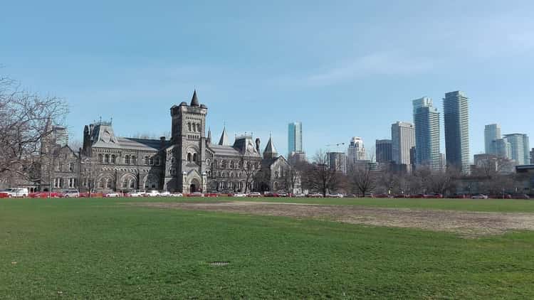 University College at the University of Toronto, a stone building with a tower in autumn light